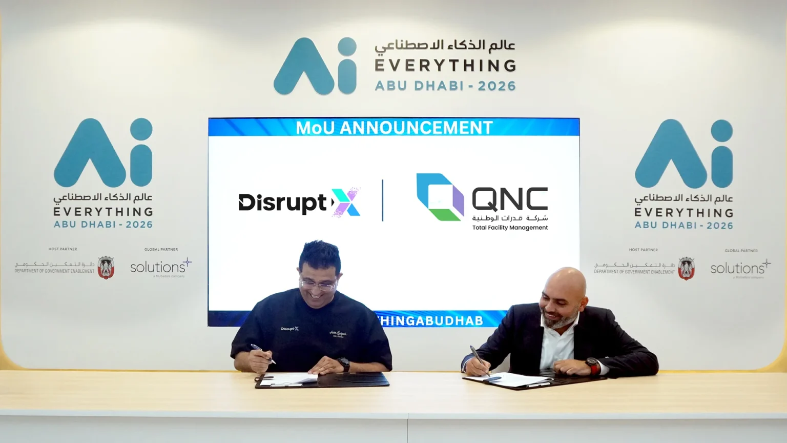 Asim Sajwani, CEO of Disrupt-X, and Ahmed Alsafadi, CEO of QNC signing MOU