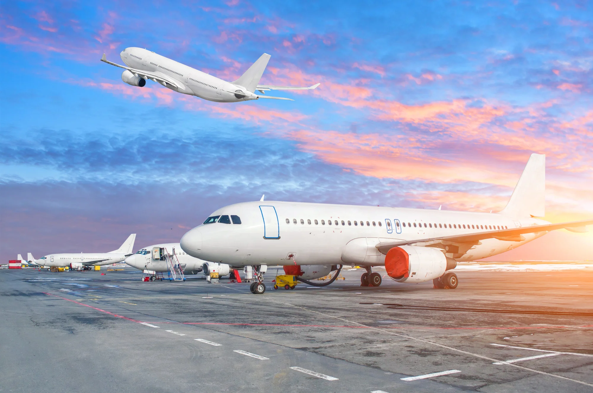 Commercial passenger airplanes parked on airport tarmac apron managed for aviation safety compliance by Disrupt-X HSEQ
