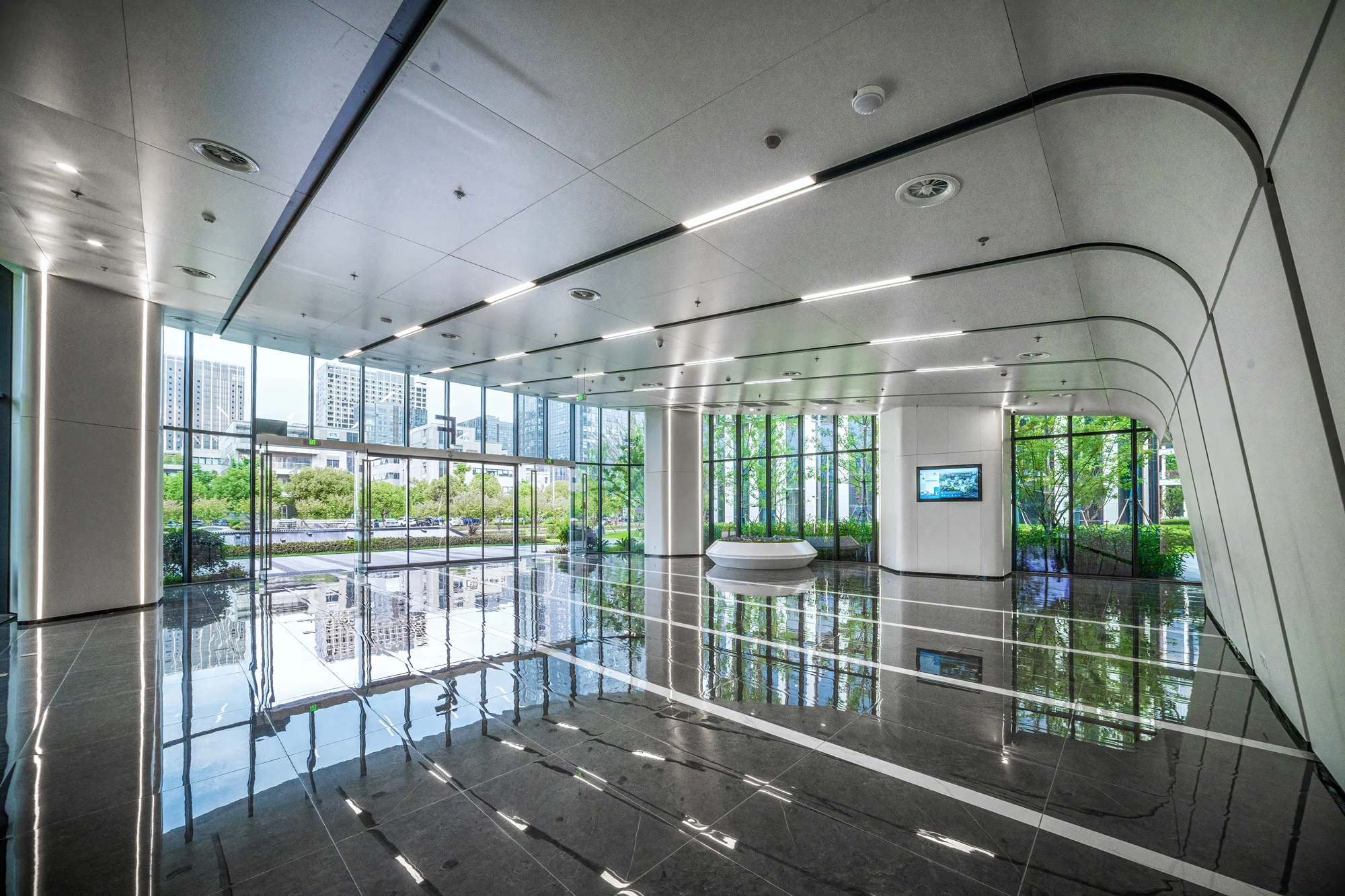 Modern corporate commercial office lobby interior representing facility safety and slip hazard management in Disrupt-X HSEQ