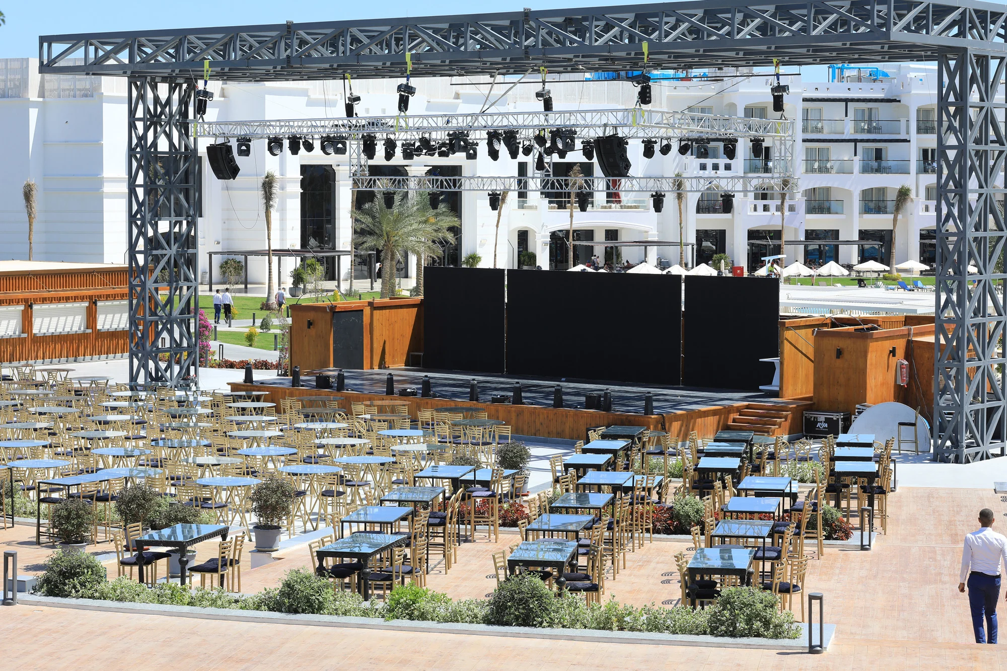 Outdoor resort concert stage with metal truss rigging and seating area managed for event safety by Disrupt-X HSEQ
