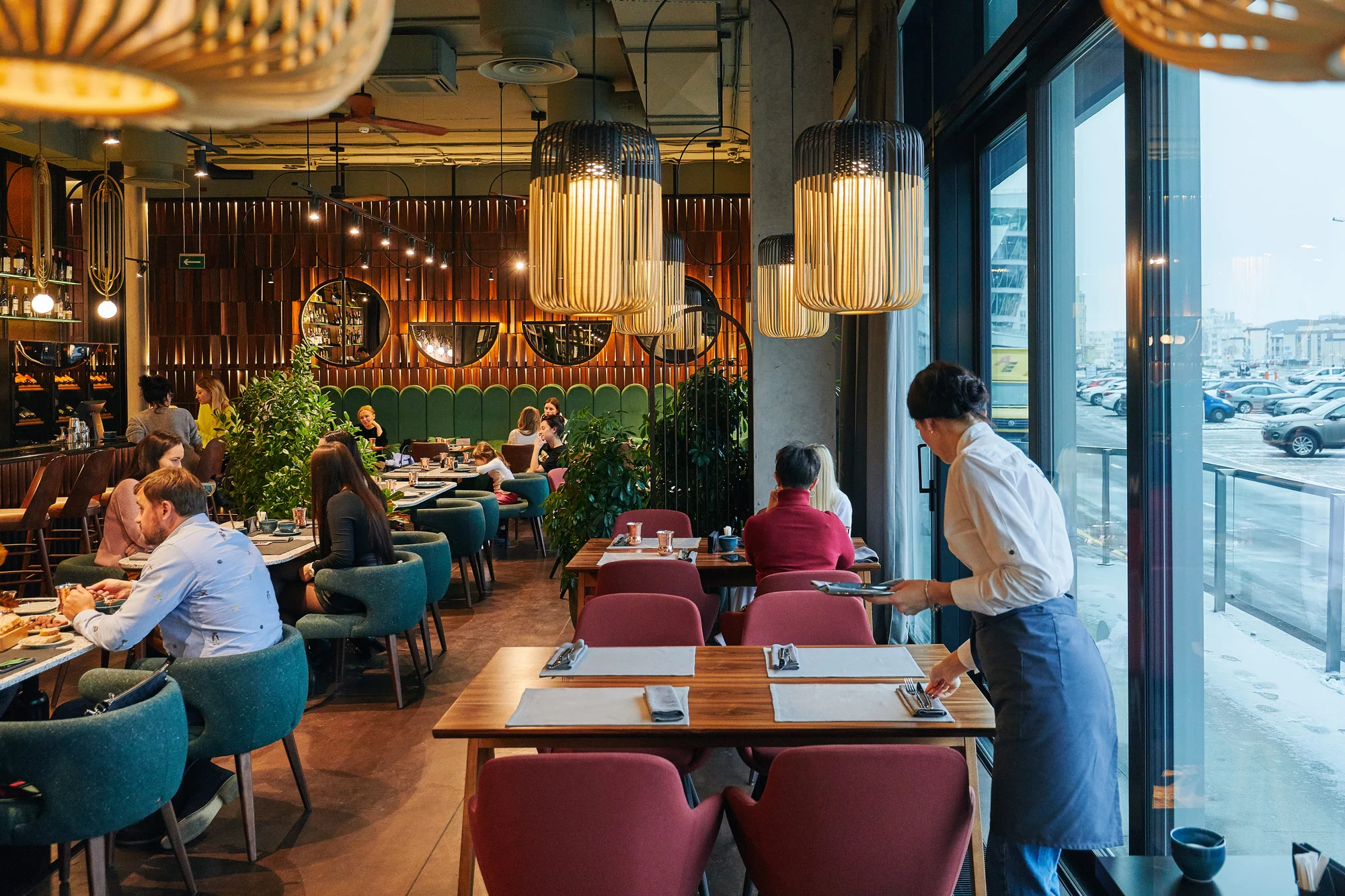 Modern restaurant dining hall and service staff adhering to hospitality food hygiene standards with Disrupt-X HSEQ