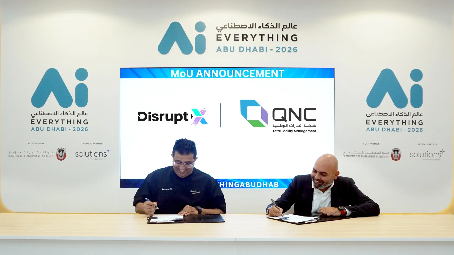 Asim Sajwani, CEO of Disrupt-X, and Ahmed Alsafadi, CEO of QNC signing MOU
